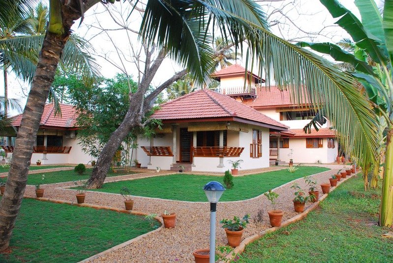 Garden paths and coconut shade at Maria Heritage